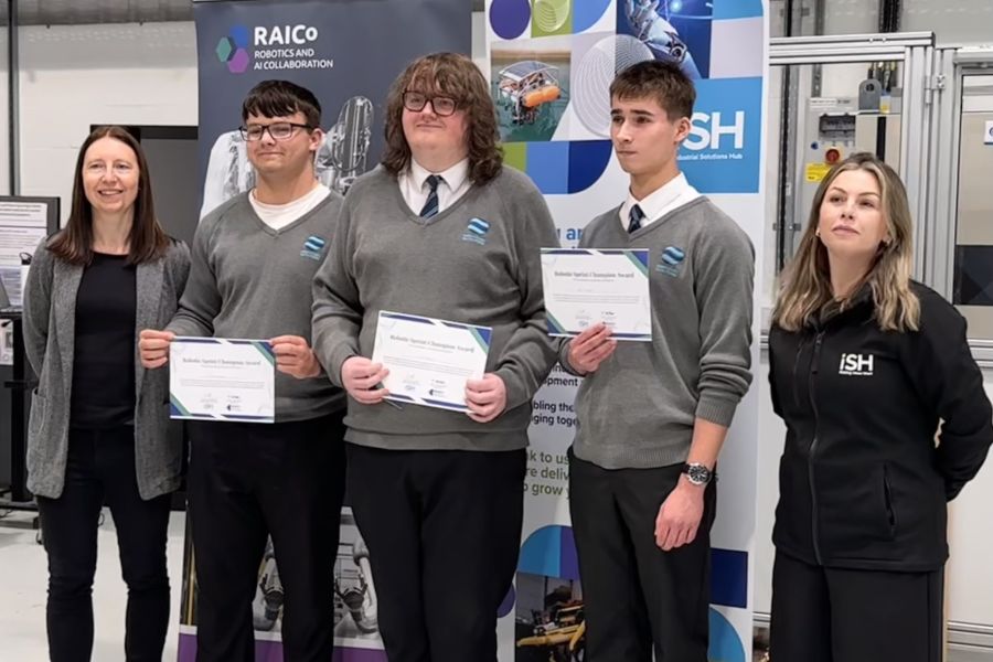 Students receiving certificates at event